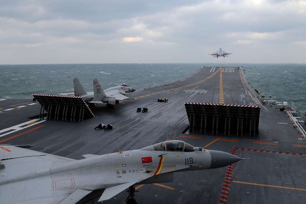 Chinese J-15 fighter jets ready for take-off from the deck of the Liaoning aircraft carrier during military drills in the East China Sea. Photo: AFP