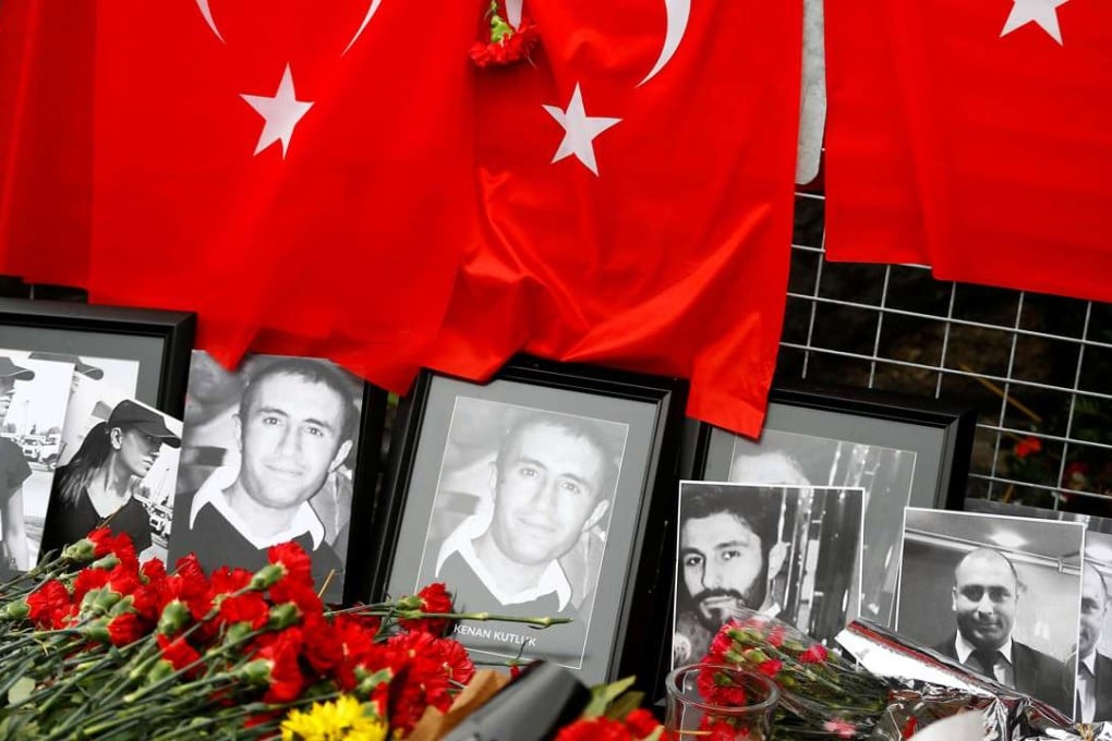 Flowers and Turkish flags are placed at a shrine to the victims near the entrance to the Reina nightclub in Istanbul on January 3. Thirty-nine people were killed when a gunman went on the rampage shortly after revellers had welcomed in the New Year. Photo: Reuters