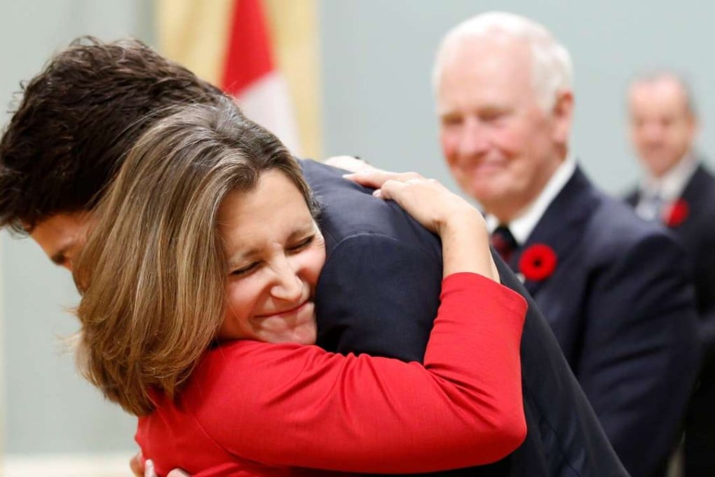 Chrystia Freeland has been appointed Canada’s new foreign minister. She is pictured being hugged by Prime Minister Justin Trudeau as Governor General David Johnston watches upon her prior appointment to the international trade portfolio in 2015. Photo: Reuters