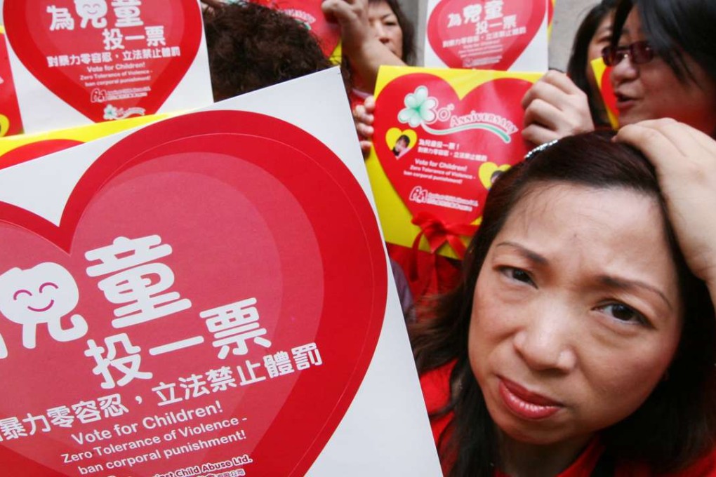Members of an NGO rally outside the Legislative Council in 2009, calling on lawmakers to outlaw corporal punishment. Photo: Martin Chan
