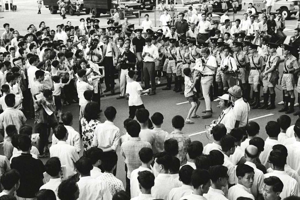 Demonstrators come face to face with police in Causeway Bay on May 22, 1967, during the early days of the riots that year that were to turn deadly. Photo: SCMP Pictures