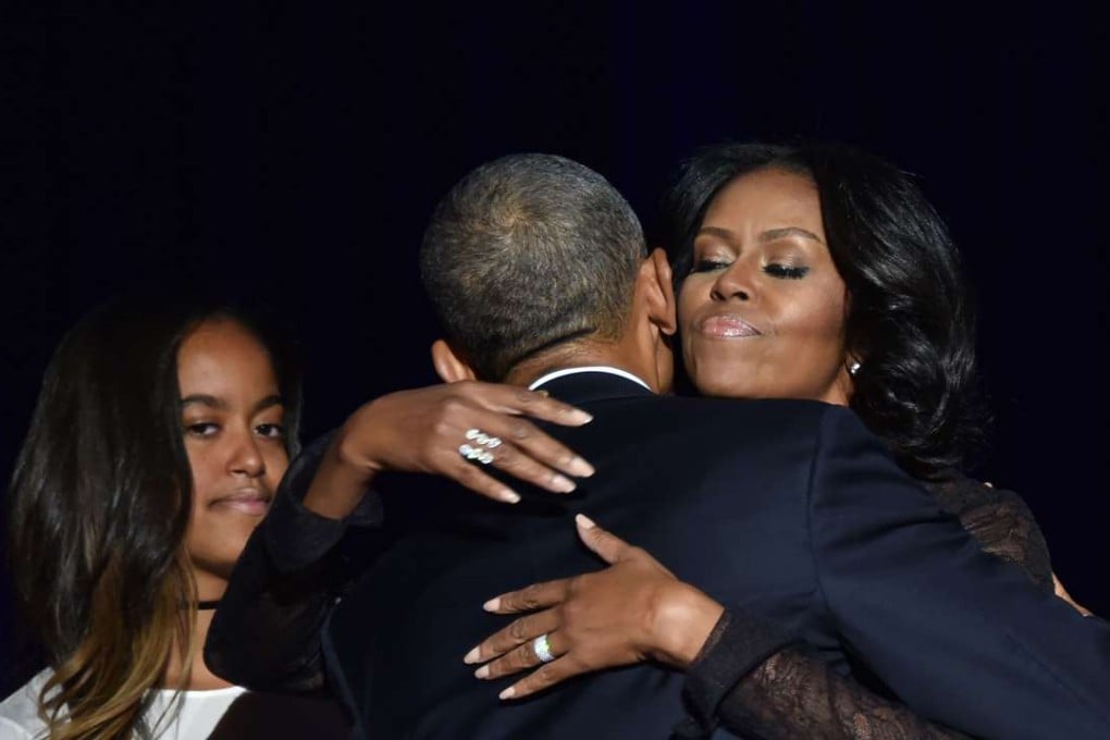 US First Lady Michelle Obama (R) hugs US President Barack Obama after the President delivered his farewell address in Chicago, Illinois. Photo: AFP