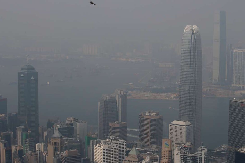 Haze blankets iconic buildings along Hong Kong’s Victoria harbour on January 8. Photo: David Wong