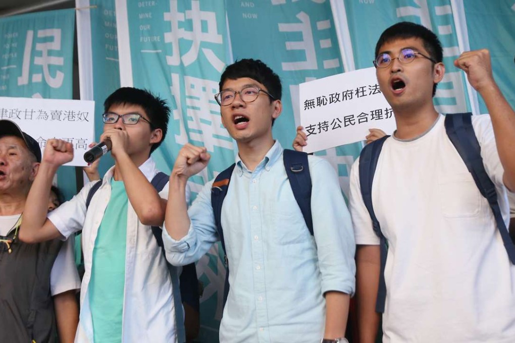 Umbrella movement leaders (from second left) Joshua Wong, Nathan Law and Alex Chow at Eastern Court in Sai Wan Ho last September. Hong Kong needs its youth to demonstrate a willingness and openness to embrace contrasting views in society. Photo: David Wong