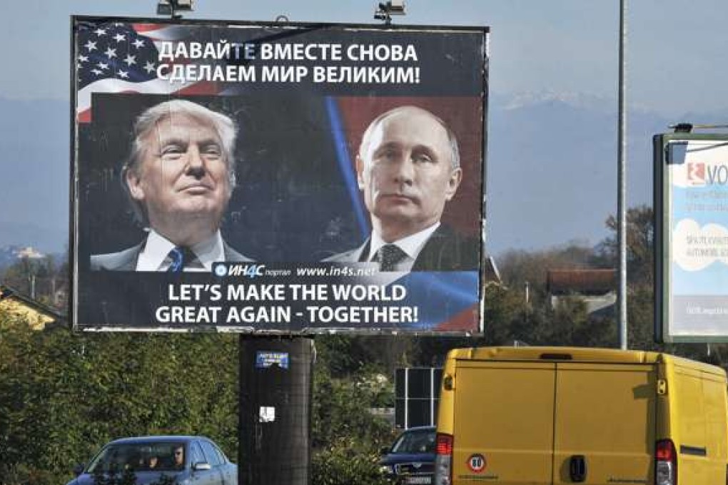Cars pass by a billboard showing US President-elect Donald Trump and Russian President Vladimir Putin in the town of Danilovgrad. Photo: AFP
