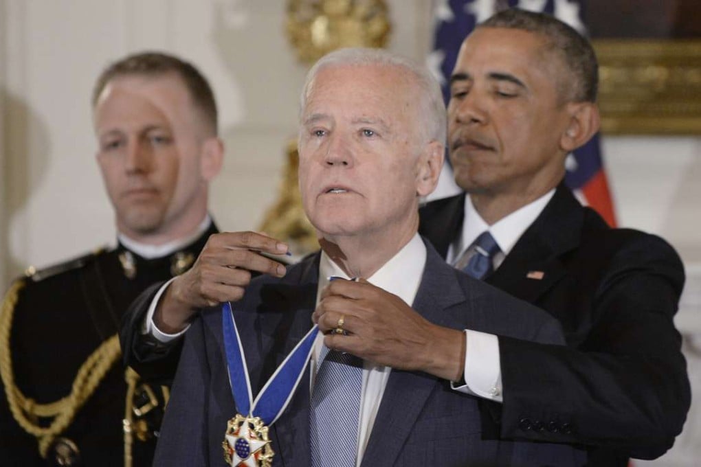 US President Barack Obama presents the Medal of Freedom to a tearful Vice-President Biden during an event in the State Dining room of the White House on Thursday. Photo: TNS