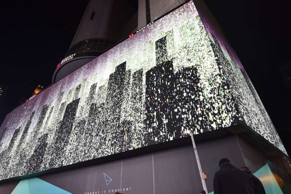 New York's Times Square illuminated by the world's highest-resolution video display screen of its size, nearly as big as a football field. Photo: AFP