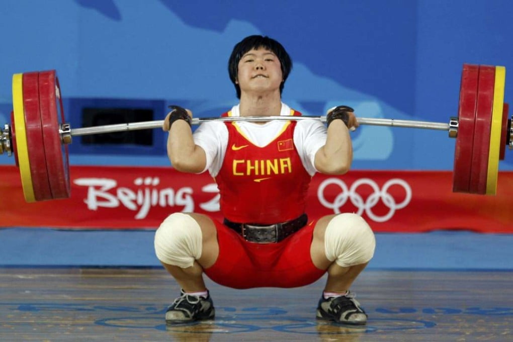 Liu Chunhong lifts 158kg to set a world record in the women's 69kg clean & jerk at the Beijing Olympic Games. Photo: Reuters