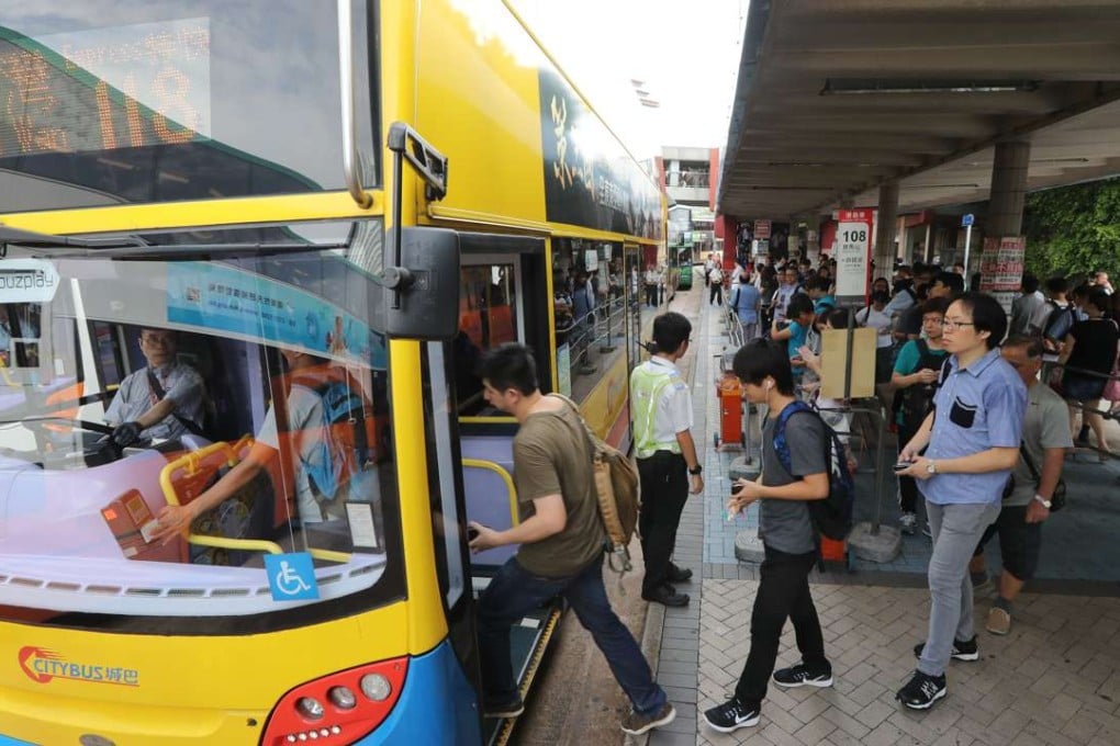 These passengers may pay less if they board after a bus has passed a tunnel. Photo: Bruce Yan
