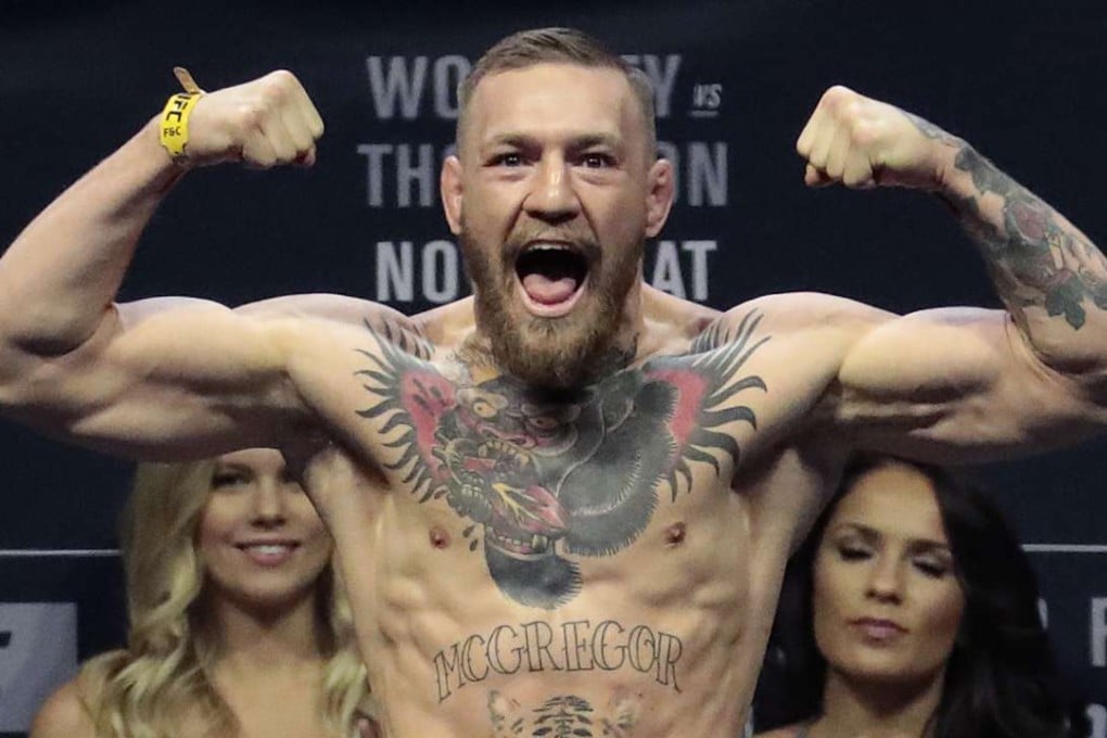 FILE - In this Friday, Nov. 11, 2016, file photo, Conor McGregor stands on a scale during the weigh-in event for his fight against Eddie Alvarez in UFC 205 mixed martial arts at Madison Square Garden in New York. Floyd Mayweather Jr. wants attention more than he wants a fight. And, really, let's be truthful here. It wouldn't be much of a fight if Mayweather and Conor McGregor met in a boxing ring. (AP Photo/Julio Cortez, File)