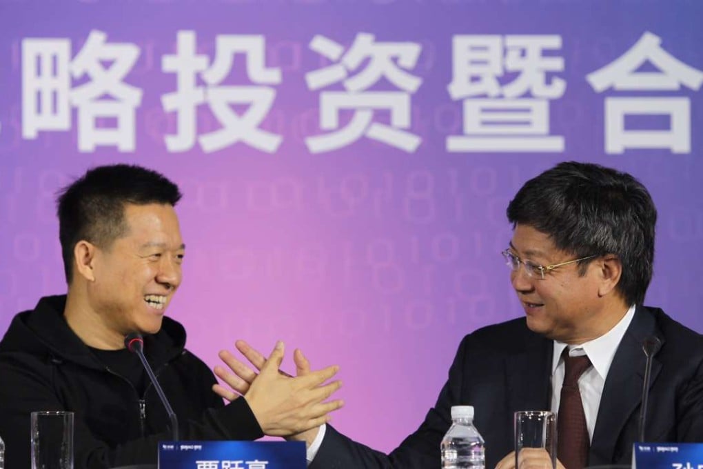 Let’s shake on it: Jia Yueting, founder and chairman of LeEco (left), and Sun Hongbin, chairman of Sunac China Holdings Limited, held a joint news conference in Beijing on Sunday. Photo: Simon Song
