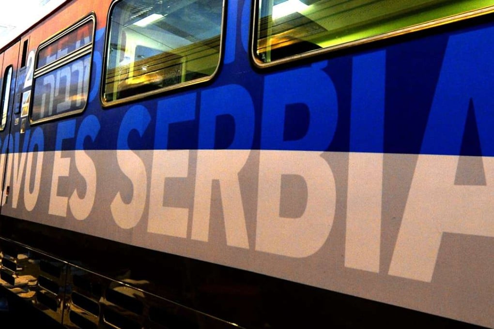 A train with the words Kosovo is Serbian written on it in different languages, before departing a railway station in Belgrade, Serbia, on Friday. Photo: EPA