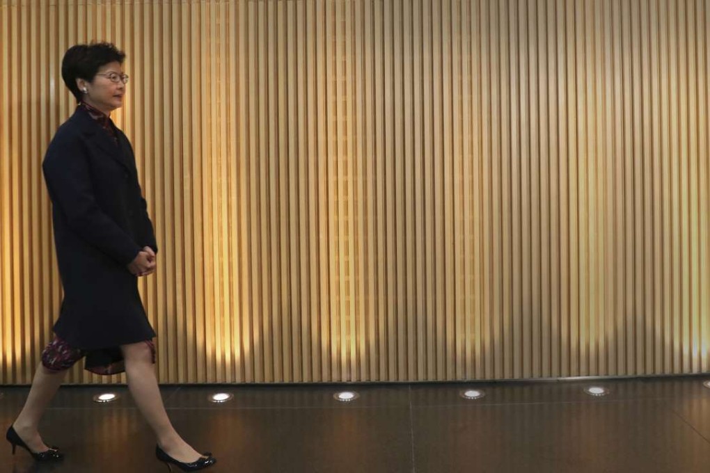 Carrie Lam arrives at a press conference at the government headquarters to announce her resignation in Hong Kong. Photo: AP