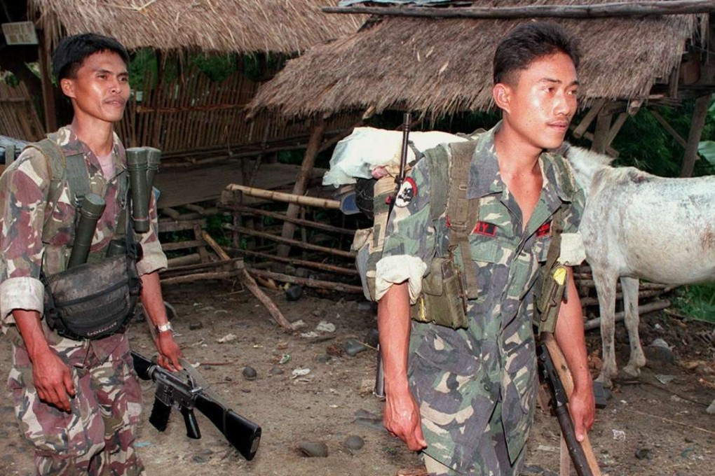 A file photo of communist guerillas from the New People's Army, one of the organisations that make up the NDFP. Photo: AFP
