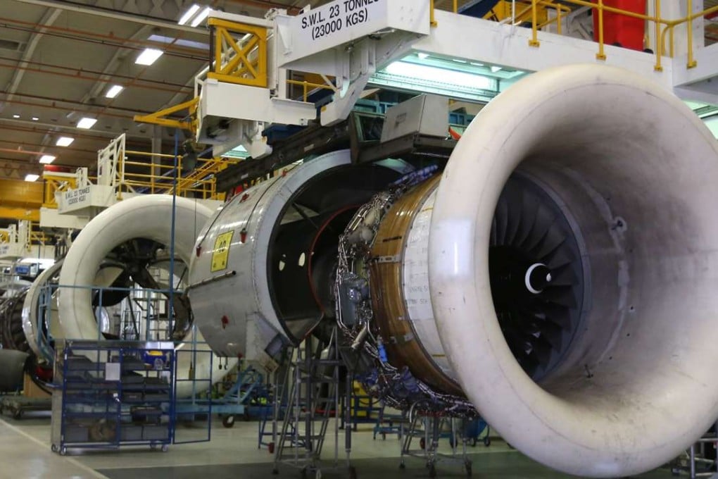 Rolls-Royce aircraft engines hang on the production line at the firm’s factory in Derby, Britain. The company bribed middlemen to help secure international orders for its plane engines, a British sourt heard. Photo: Bloomberg