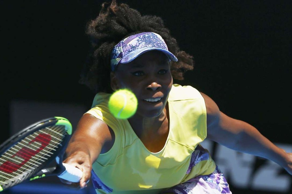 Venus Williams hits a return to Stefanie Voegele. Photo: Reuters