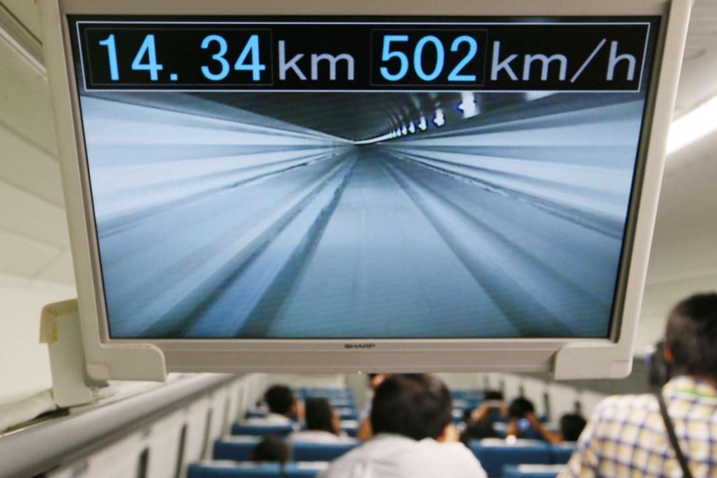 A screen monitor inside Central Japan Railway Co’s L0 series maglev train shows the train is running at a speed of over 500 km/h during a test-ride event for the press on September 22, 2014, in Tsuru, central Japan. But so-called hyper-tube trains could run much faster because of the absence of air resistance. Photo: Kyodo