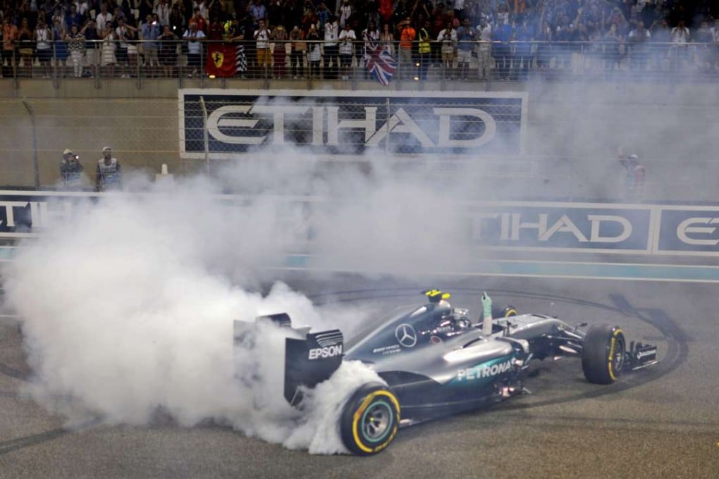German driver Nico Rosberg celebrating at the end of the Abu Dhabi Formula One Grand Prix at the Yas Marina circuit. Photo: AFP