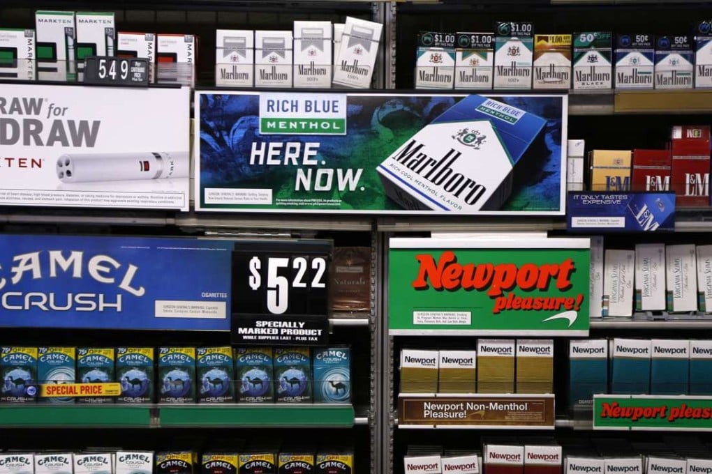 Camel and Newport cigarettes, both Reynolds American brands, are on display at a Smoker Friendly shop in Pittsburgh. British American Tobacco Plc has agreed to fully take over Reynolds American Inc. on terms that are improved from an initial bid made last year. Photo: AP