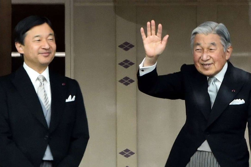 Japan's Emperor Akihito waves to well-wishers beside Crown Prince Naruhito during their new year greetings in Tokyo on January 2, 2015. Photo: AFP
