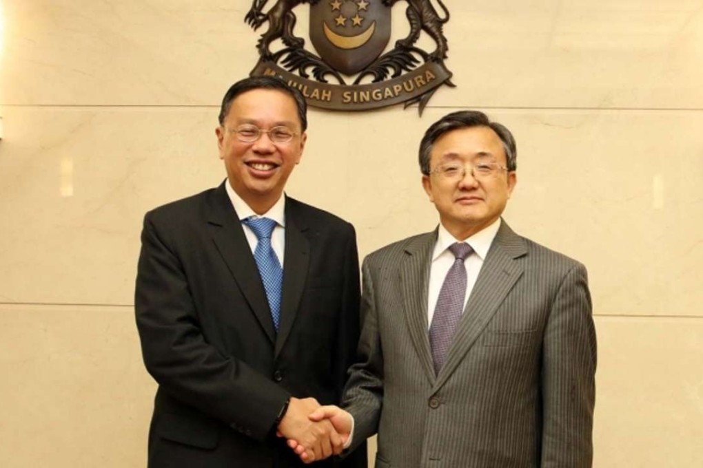 Singapore’s Permanent Secretary for Foreign Affairs Chee Wee Kiong (left) with Deputy Foreign Minister Liu Zhenmin in Singapore on Tuesday. Photo: Handout