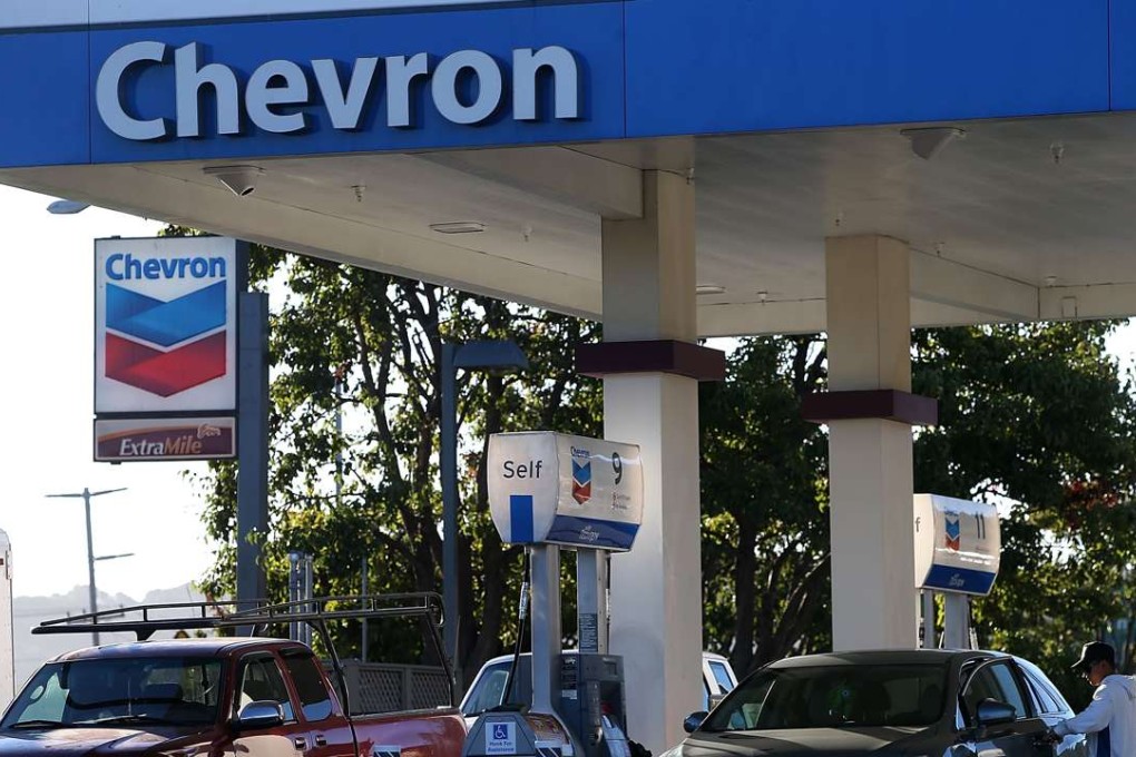 Customers getting gasoline at a Chevron station in Corte Madera, California. US consumer prices continued to rise in December, with one measure of price gains registering its biggest increase in two and a half years. Photo: AFP