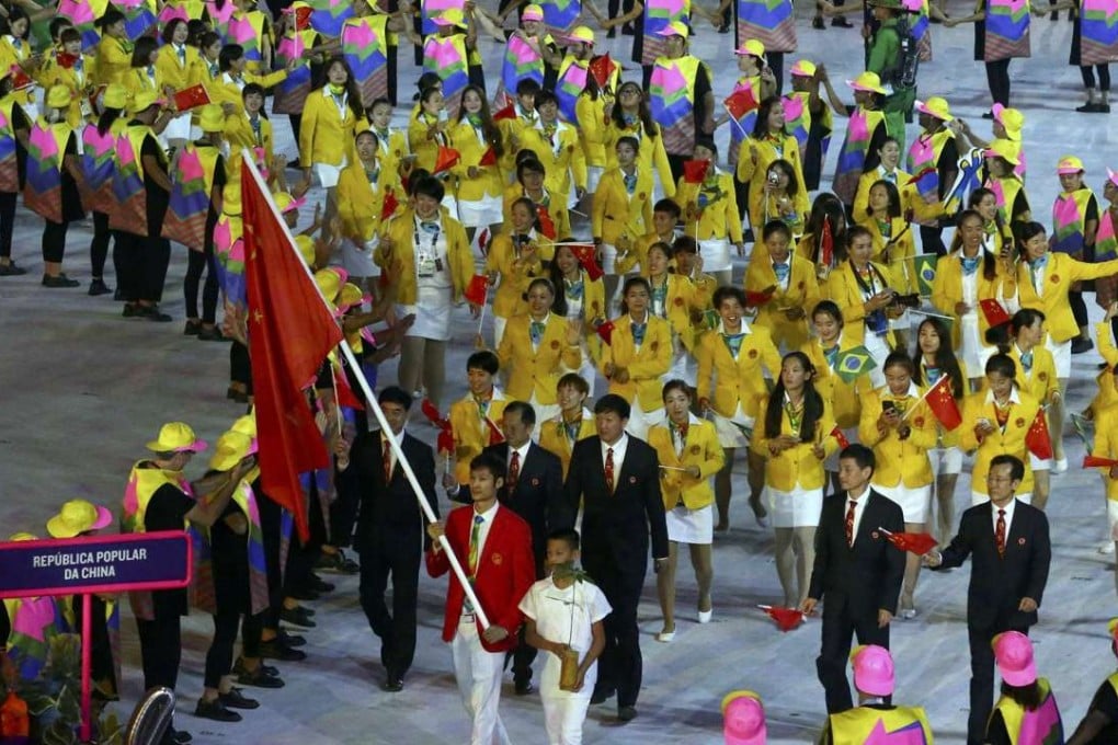 Flagbearer Sheng Lei of China leads his contingent during the opening ceremony in Rio de Janeiro. Photo: Reuters