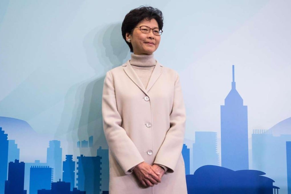 Carrie Lam poses for photos at a press conference earlier this month to announce her candidacy for the chief executive election. She told a gathering of senior civil servants that God had called on her to run. Photo: AFP
