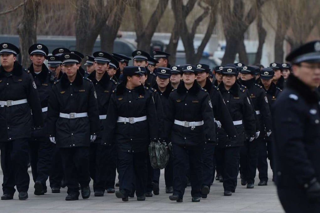 Police pictured marching towards Tiananmen Square during a meeting of the nation’s main political consultative body in Beijing. Photo: AFP