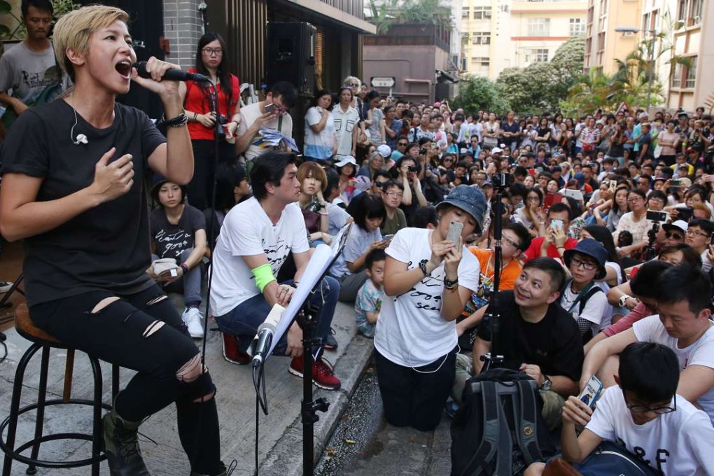 Singer Denise Ho performs on a street in Sheung Wan in June last year. Her fan base has grown in the wake of her being blacklisted by China. Photo: Sam Tsang
