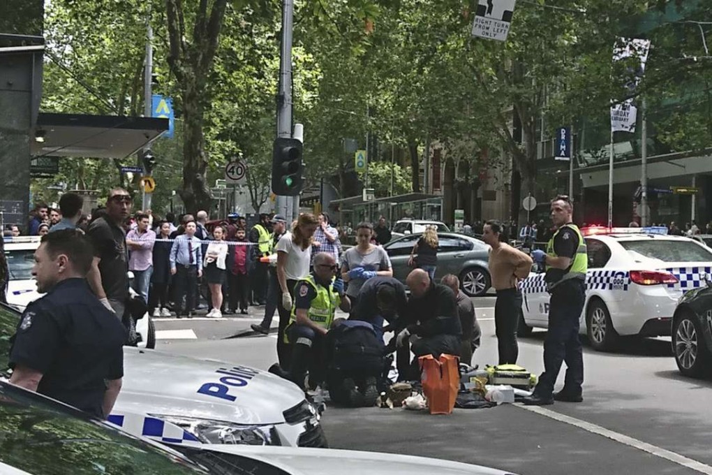 Police and emergency services gather at the scene after a car is believed to have hit pedestrians in Bourke Street Mall in Melbourne, Australia. Photo: AP