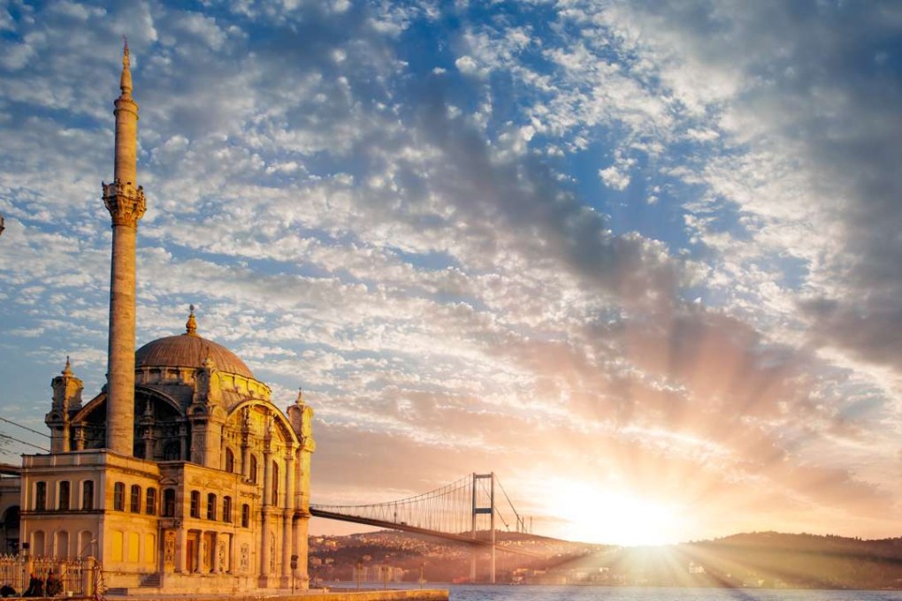 Ortakoy mosque and the First Bosphorus Bridge in Istanbul, Turkey. East and West have collided here for millennia.