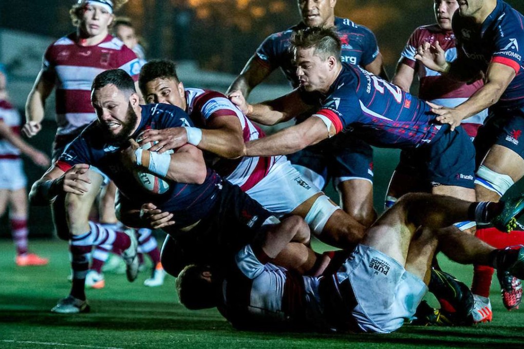 Conor Hartley drives towards the try line for HK Scottish against Kowloon in the Hong Kong Premiership. Photos: HKRU
