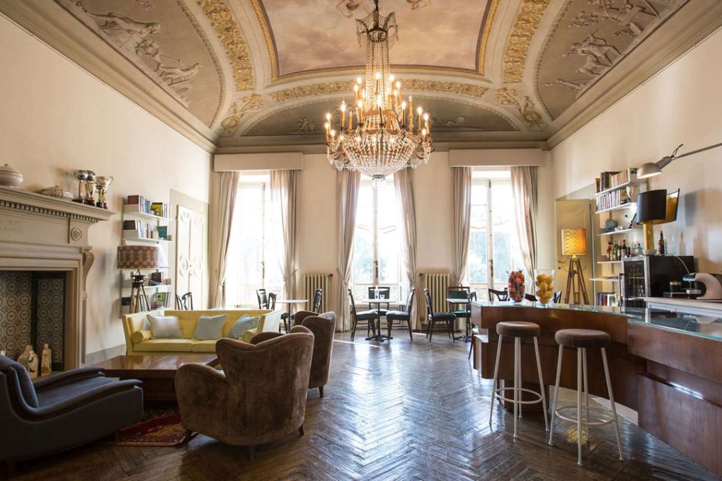 The high-ceilinged living room of the AdAstra, in Florence.