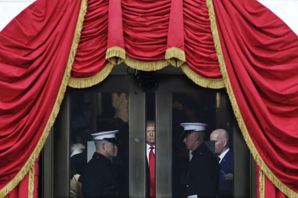 Donald Trump waits to step out onto the portico for his presidential inauguration. Photo: AP