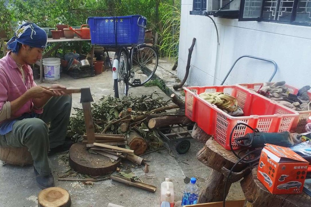 Tam Wan-ho chops wood at Toyau, an eco-village in Sheung Shui. Photo: SCMP