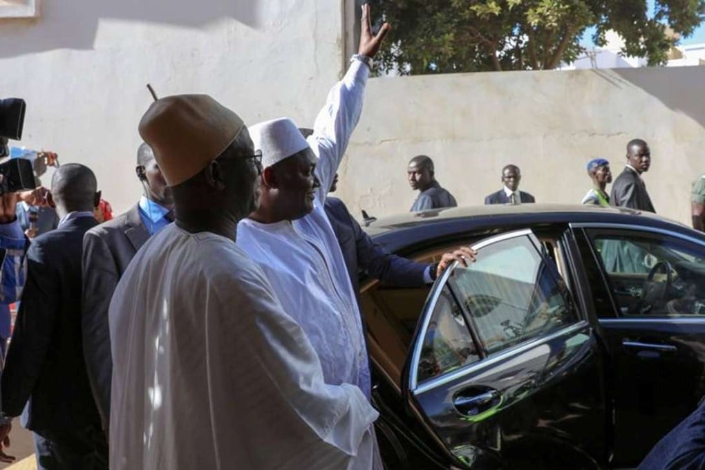 Gambia President Adama Barrow waves to well-wishers after his inauguration ceremony at the Gambian embassy in Dakar, Senegal. Photo: Reuters