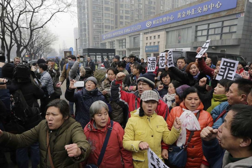 A file photo of supporters of rights lawyer Pu Zhiqiang gather near a Beijing court where his trial was heard in December 2015 following the authorities’ massive crackdown against rights lawyers and dissidents. Photo: AP
