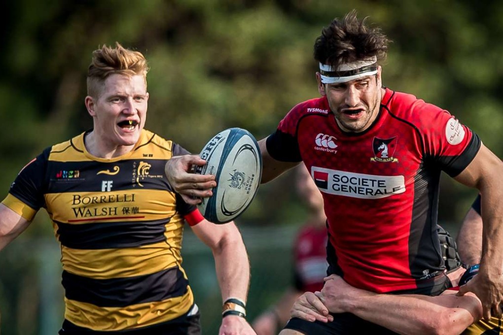 Valley’s Ally Maclay takes on the tackler in his side’s draw with Tigers in the Hong Kong Premiership. Photo: HKRU