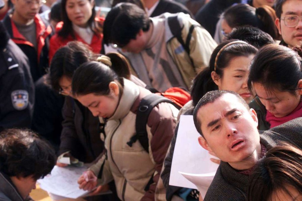 Chinese graduates apply to work as civil servants in Shanghai. More and more graduates are competing to serve in government as they exit university life due to the uncertain global economic future. Photo: Reuters