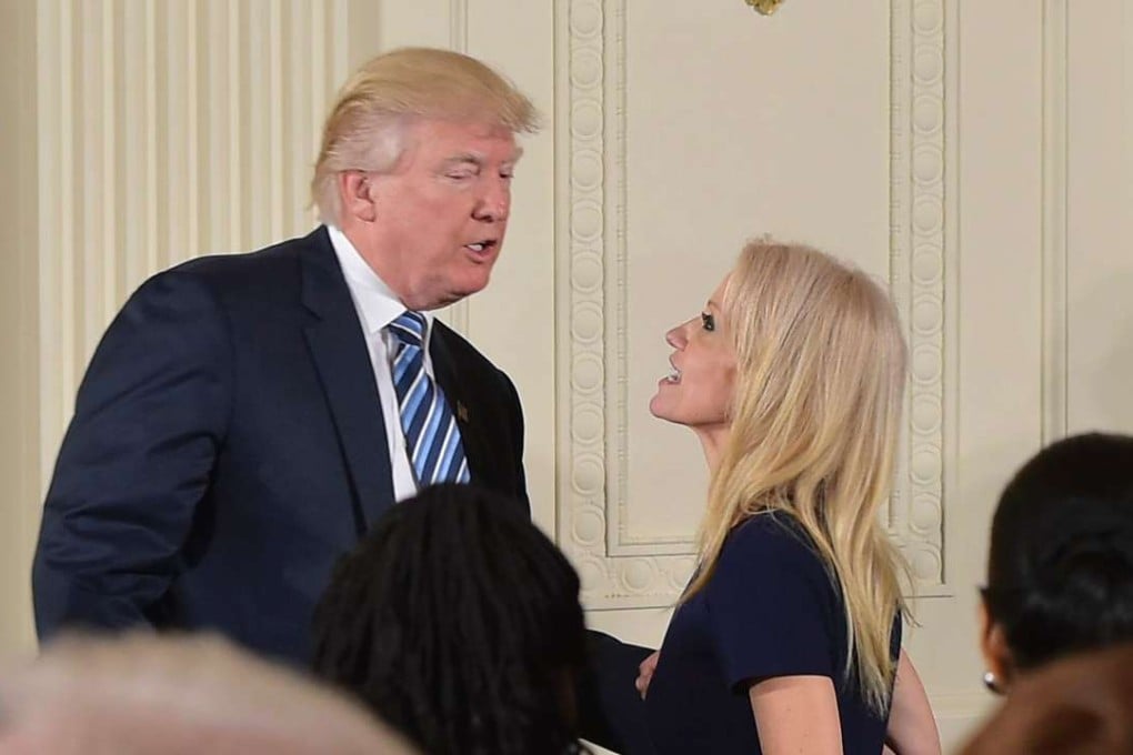 US President Donald Trump speaks with Counsellor to the President Kellyanne Conway after the swearing in of the White House senior staff at the White House on Sunday. Photo: AFP
