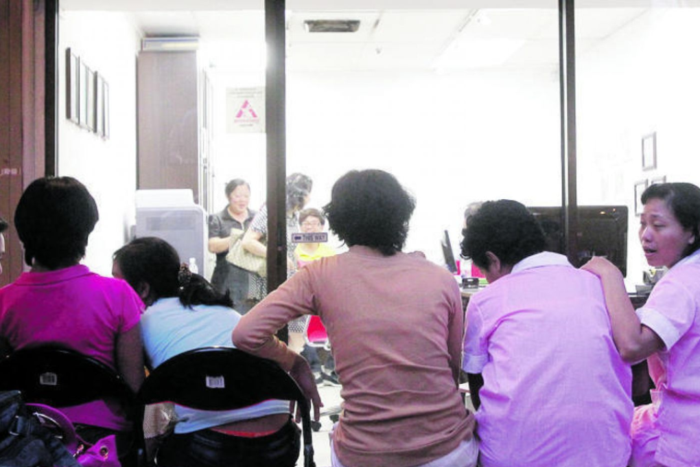 Foreign domestic helpers at a maid agency. Photo: TODAY file photo