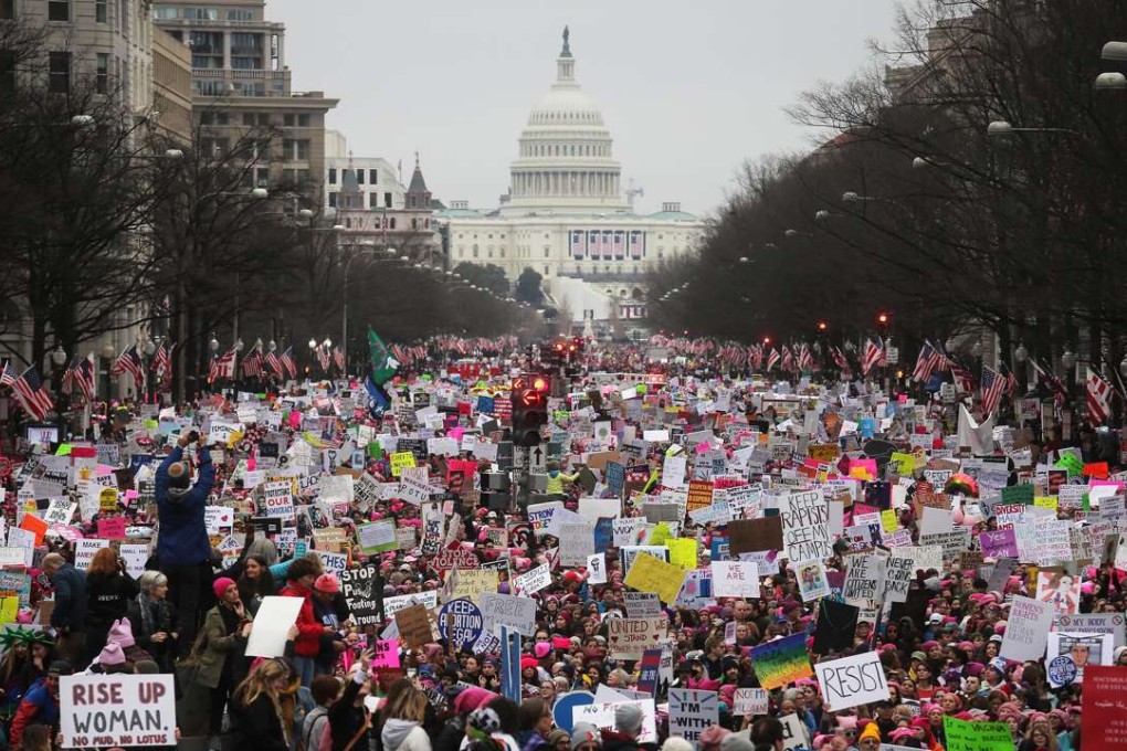 Protesters walk up Pennsylvania Avenue during the Women's March on Washington. Photo: AFP