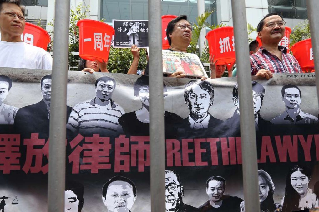 Protesters march to the central government’s liaison office in Hong Kong to mark the first anniversary of the mass arrest of human rights lawyers on the mainland, last July 9. Photo: Dickson Lee