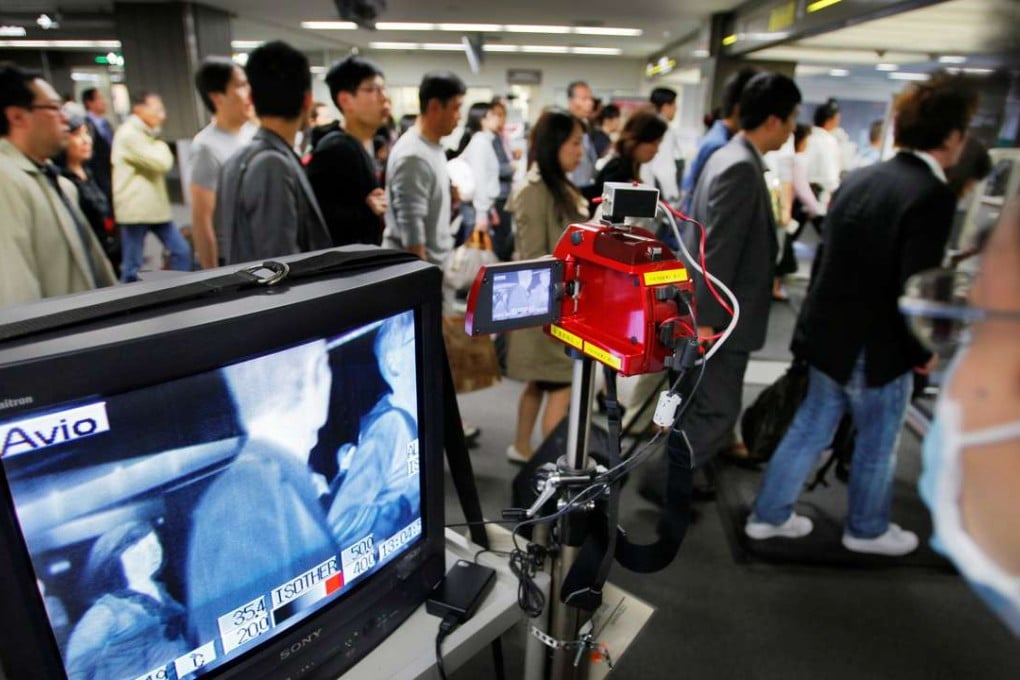 People queue for immigration at Narita International Airport, east of Tokyo. Photo: AP