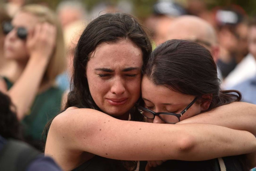 Mourners gathered at Melbourne’s Federation Square for a minute’s silence to remember those killed in the tragedy. Photo: AFP