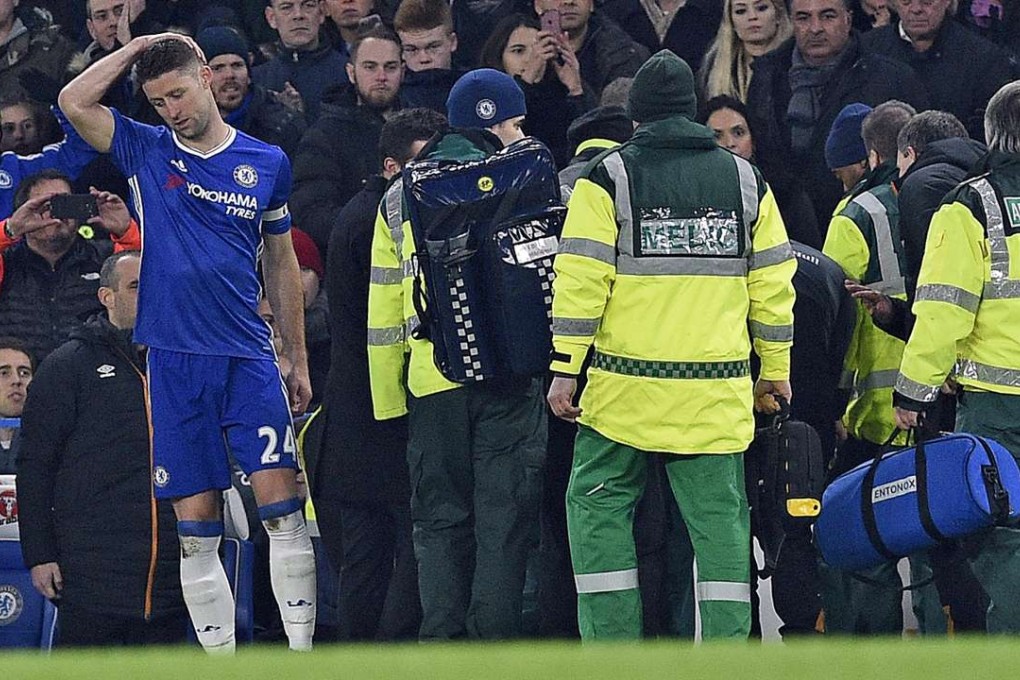 Hull City’s Ryan Mason is carried off after a collision with Chelsea’s Gary Cahill. Photo: EPA