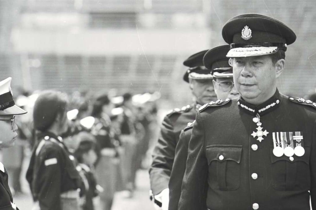 A file picture of Li Kwan-ha (right), then commissioner of police, inspecting a parade. Photo: SCMP