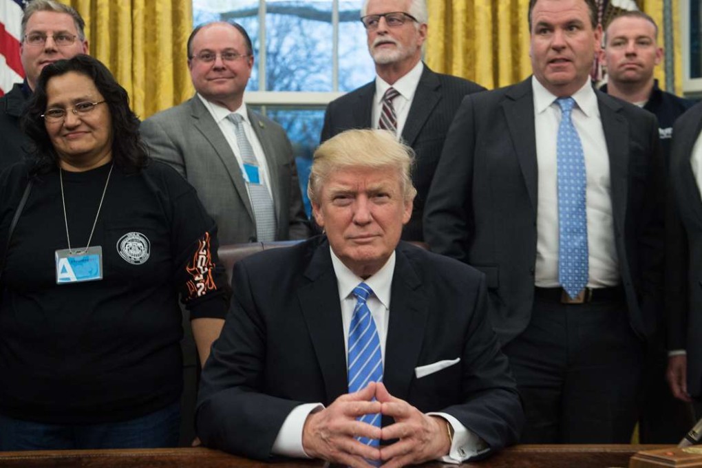US President Donald Trump poses with labour leaders in the Oval Office at the White House. So here we are. Trump is president. He’s given the speech. Now comes the tricky bit. Photo: AFP