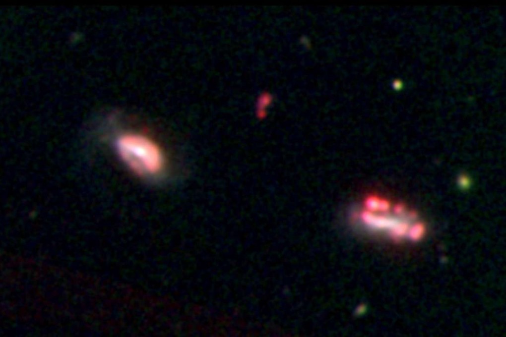 A handout photo released on Monday shows an optical image of one of the isolated galaxy groups observed with the Magellan Telescope in Chile. The first sighting of clustered dwarf galaxies bolsters a leading theory about how big galaxies such as our Milky Way are formed, and how dark matter binds them. Photo: AFP